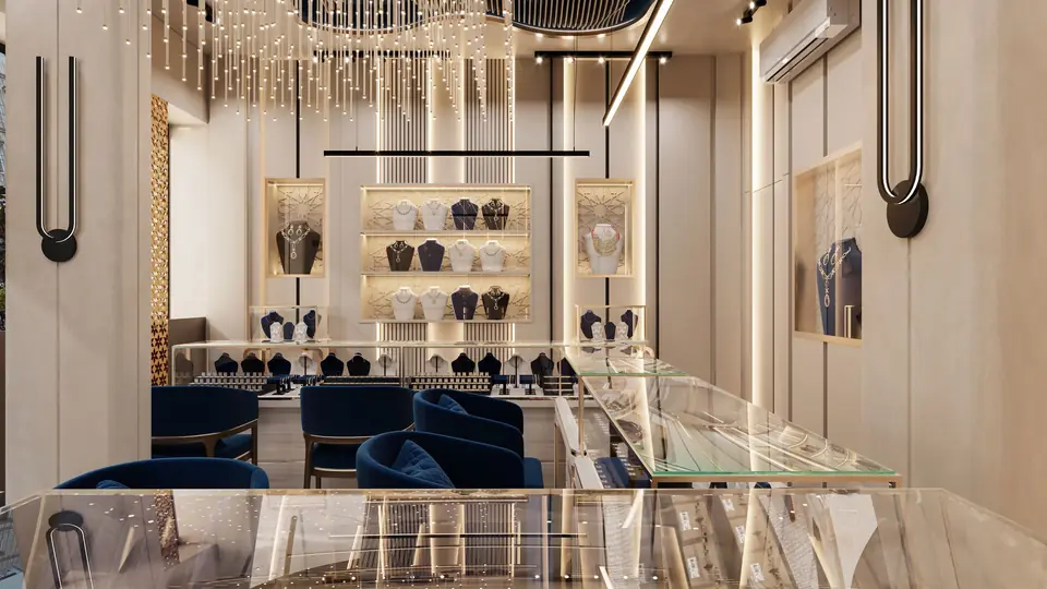 The warmly lit interior of a jewellery boutique with velvet chairs and glass display cases